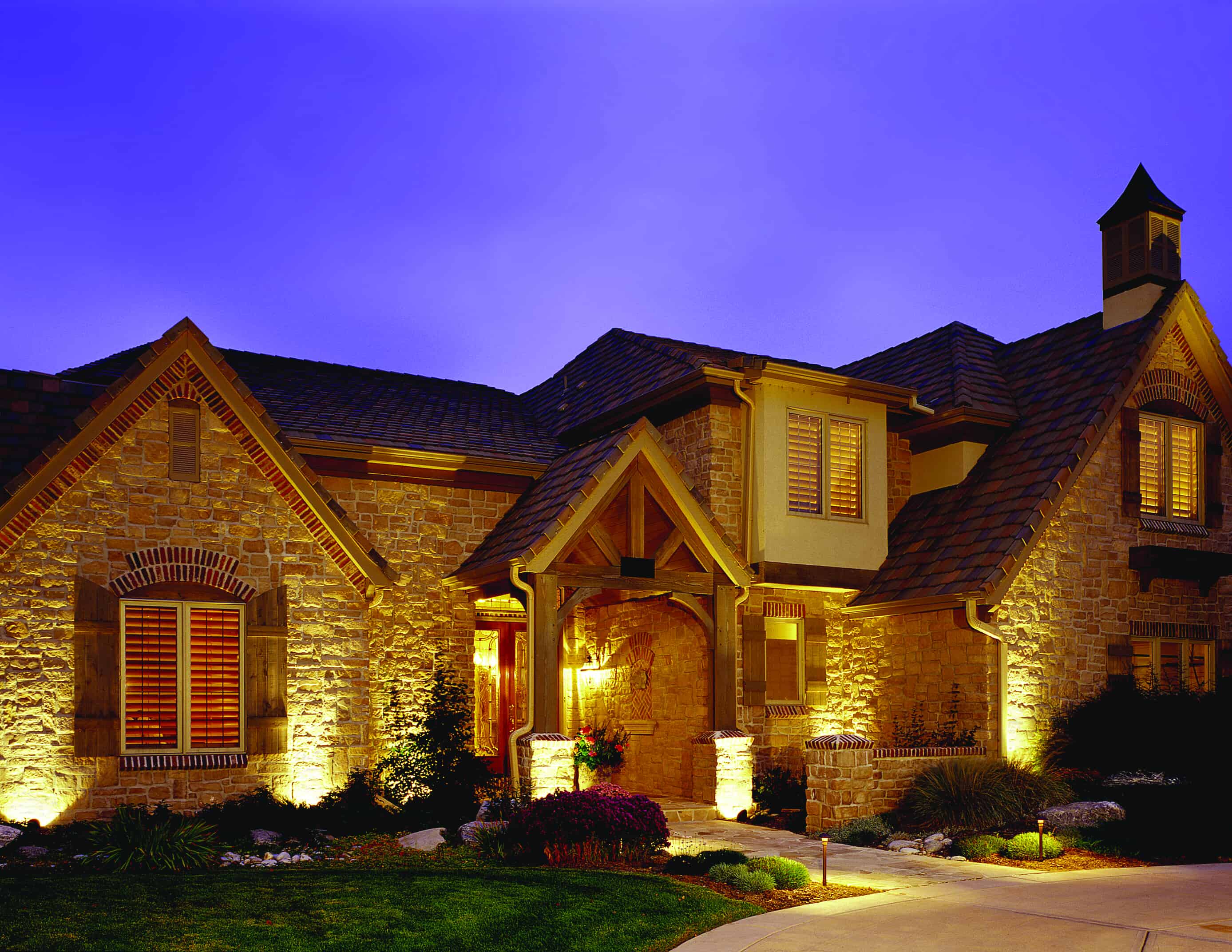 Home with outdoor lighting
